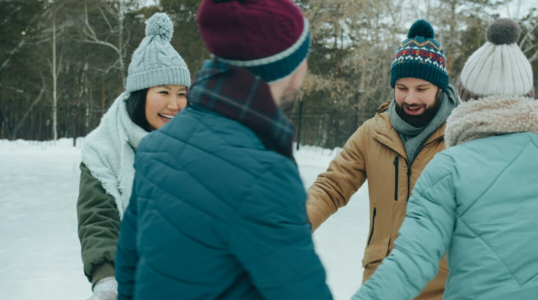 Two Brazilian friends having a warm conversation outdoors