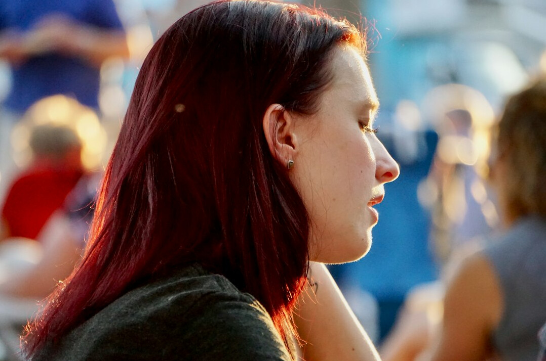 Person listening attentively during a conversation