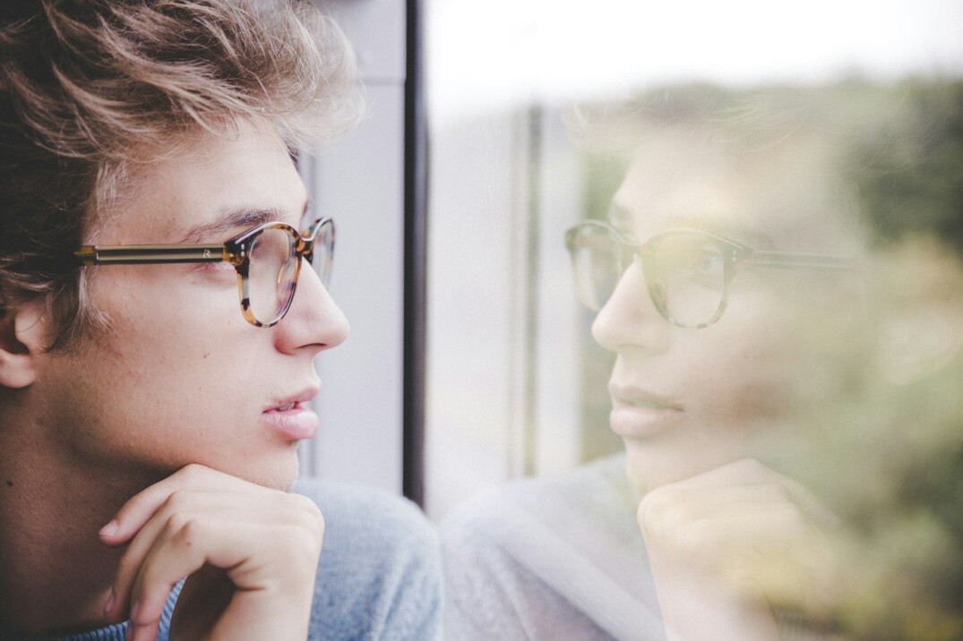 person reflecting thoughtfully